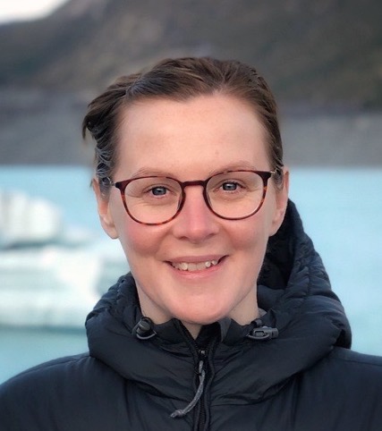 A smiling Kelly-Anne Lawler with icebergs in the background